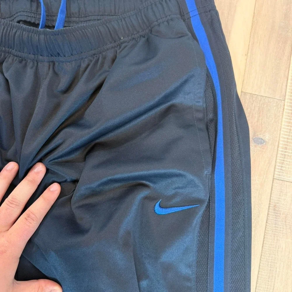 2000s baggy Nike black track pants with blue stripe sz XL